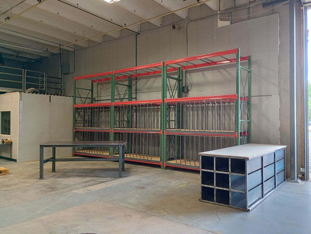 Custom fabricated pallet rack spring and rail storage system with vertical dividers for garage door manufacturer in Colorado Springs